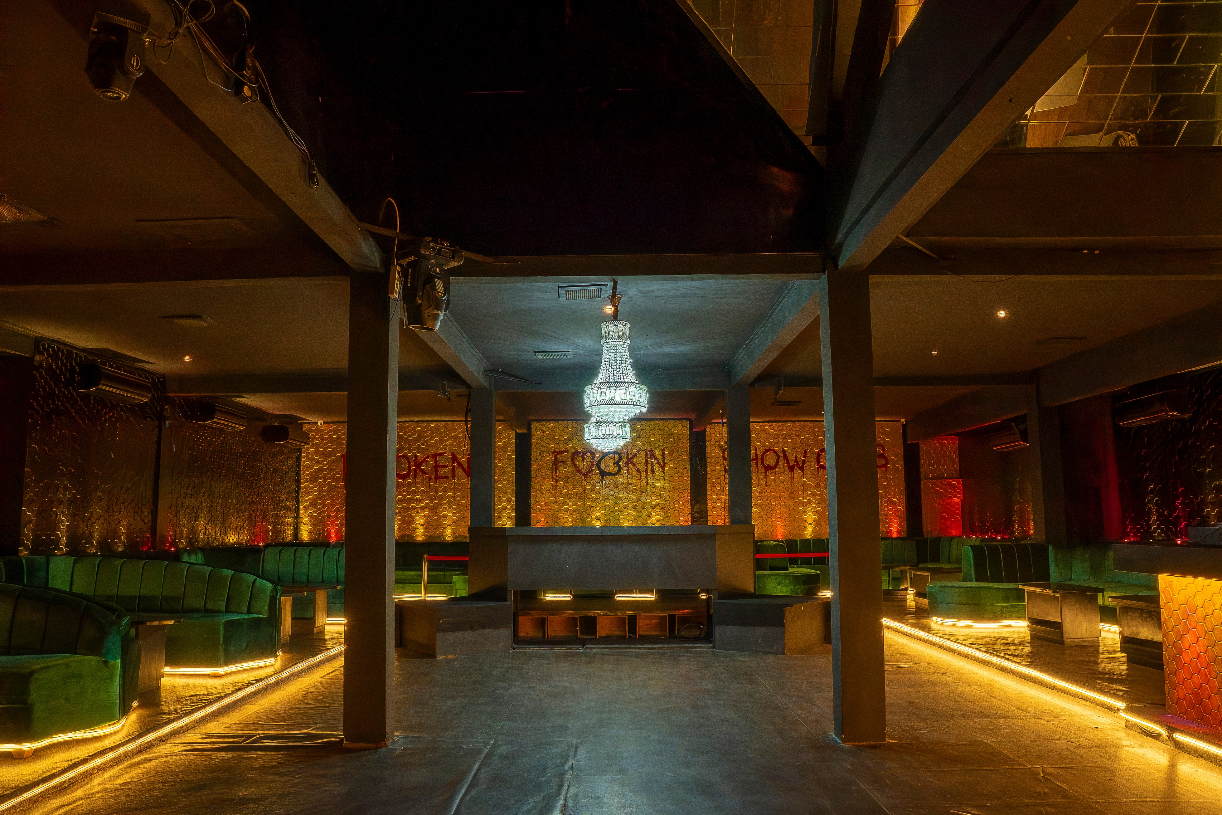 Nightclub main floor with crystal chandelier and LED-lit platforms
