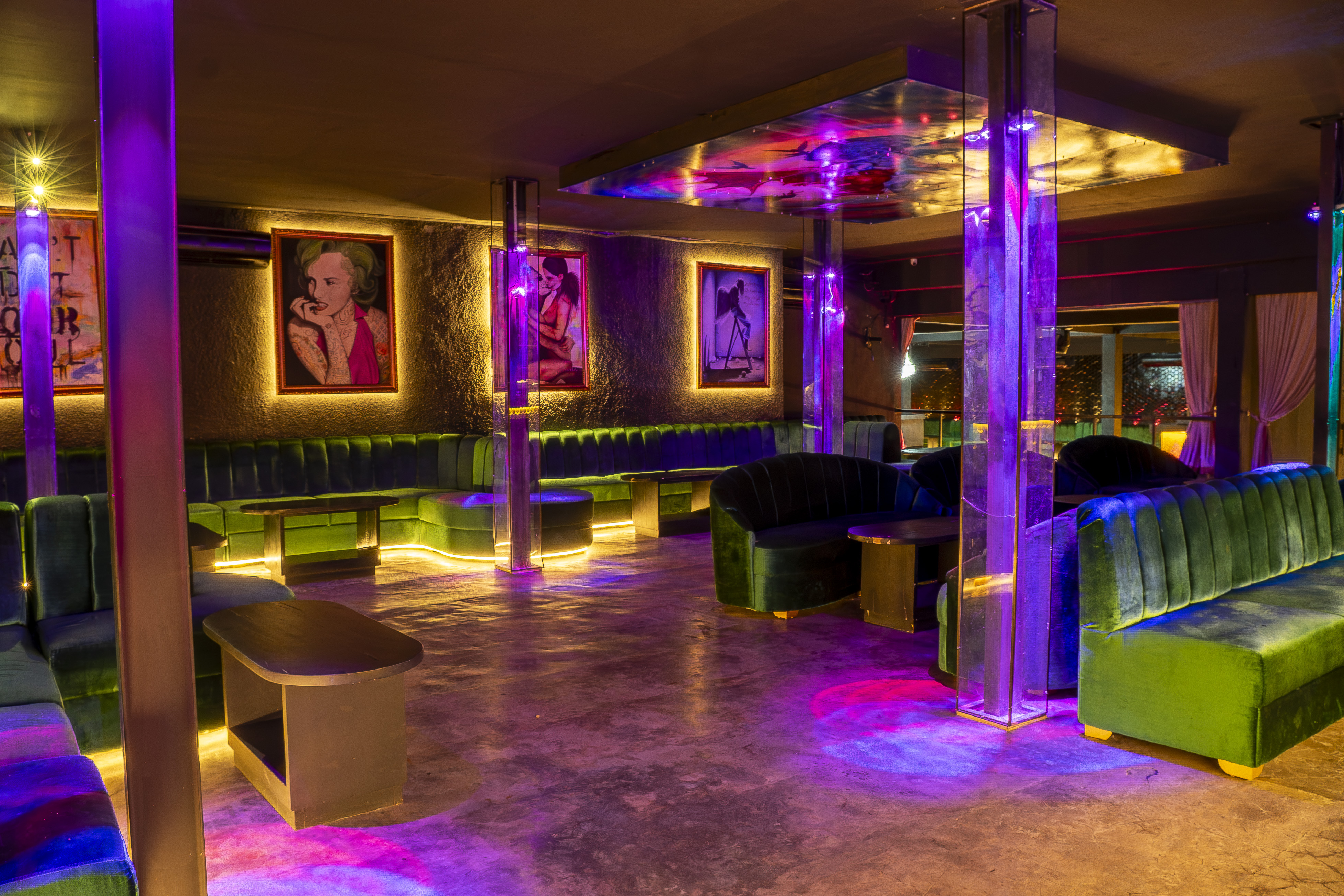 VIP seating area with acrylic columns and artwork