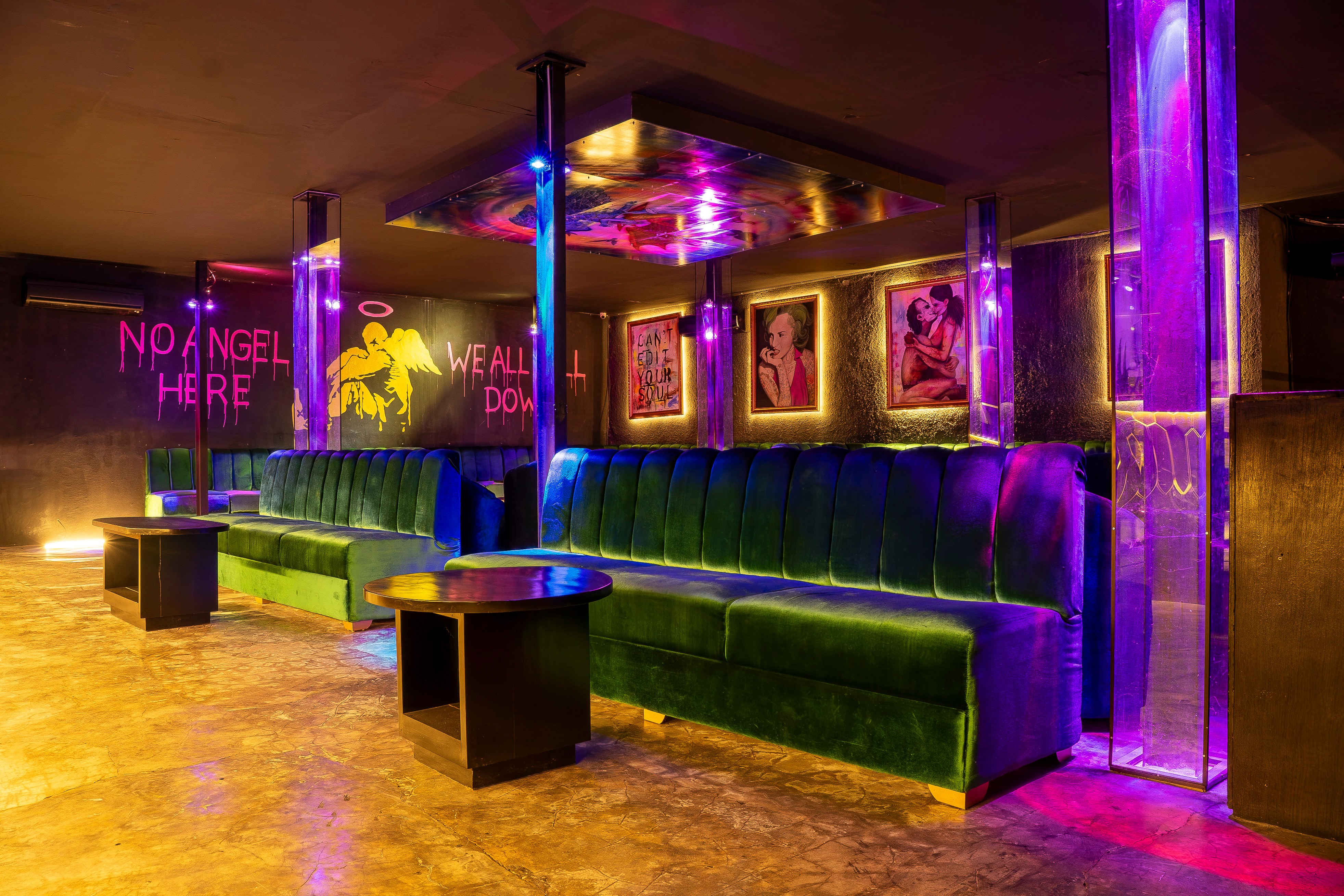 VIP booth with acrylic poles and framed artwork